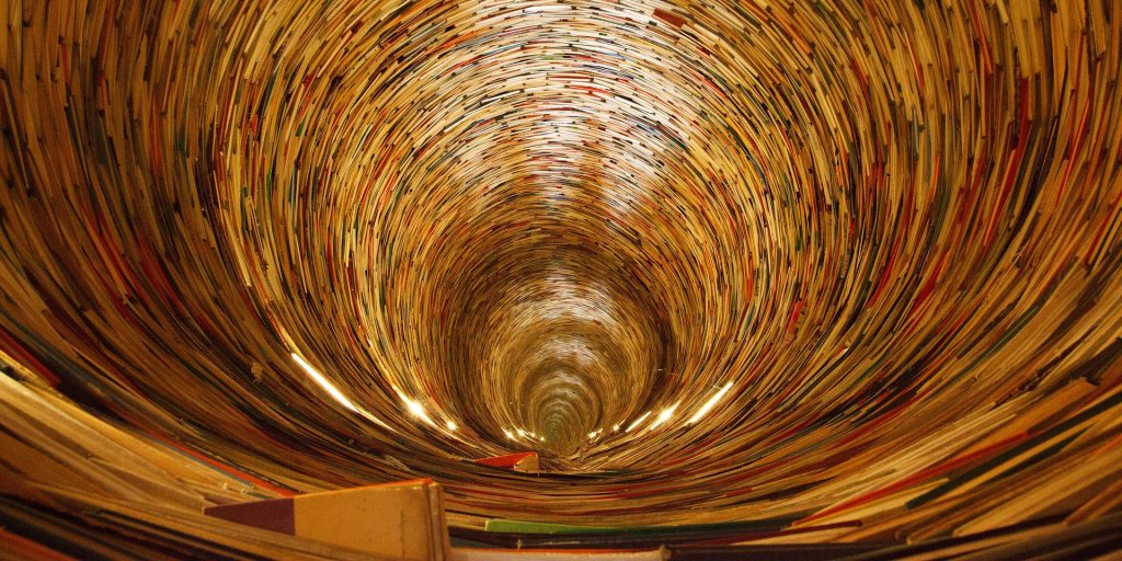 A view through a tunnel made of books: Circle library, in Prague.